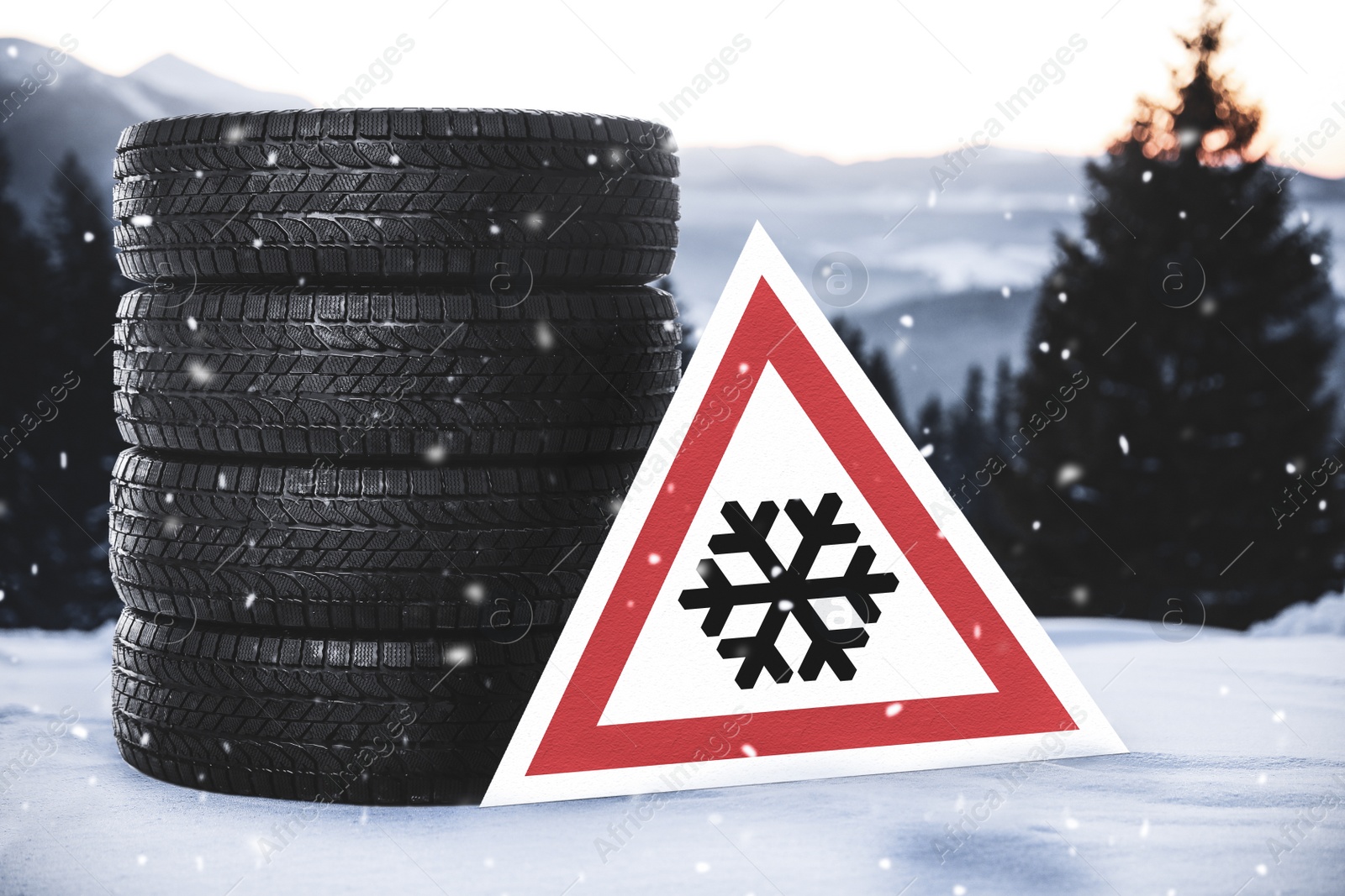 Image of Set of winter tires and road sign outdoors