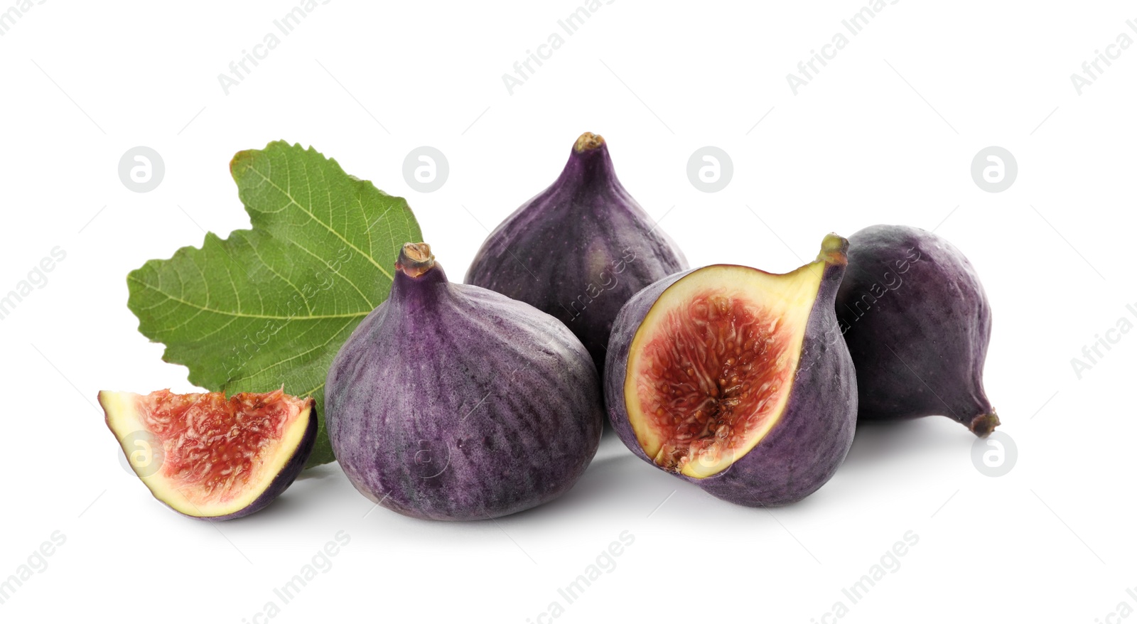 Photo of Tasty whole and cut figs with green leaf isolated on white