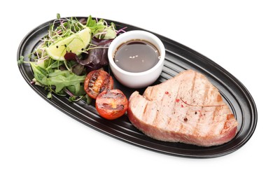 Photo of Delicious tuna steak, salad, tomato and sauce on white background