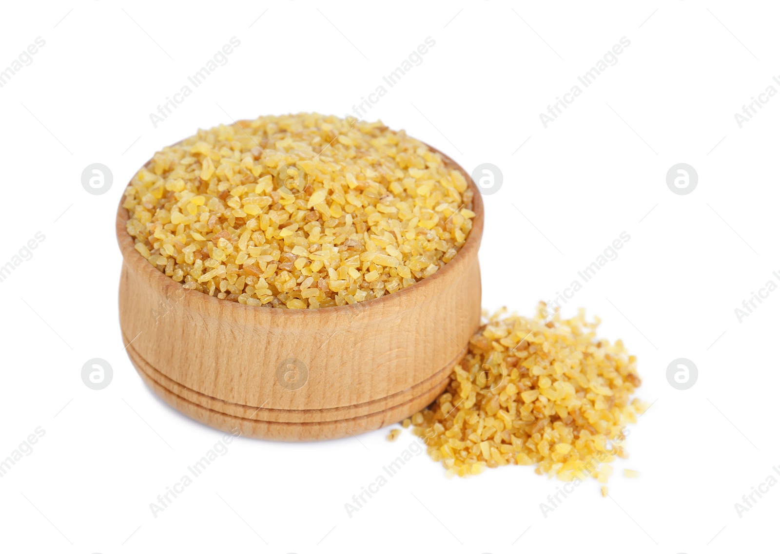 Photo of Wooden bowl with uncooked bulgur on white background