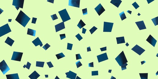 Image of Shiny blue confetti falling on light green background. Banner design