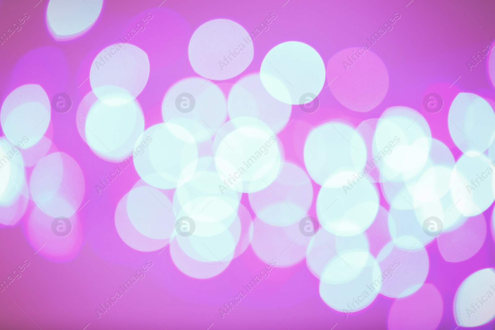 Photo of Beautiful glowing lights as background. Bokeh effect