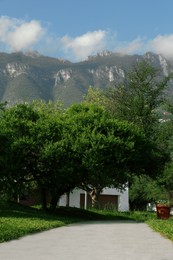 Photo of Beautiful view of park and green mountains on sunny day