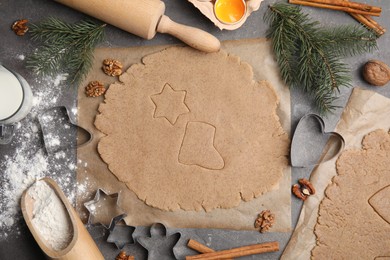 Homemade Christmas cookies. Flat lay composition with dough on grey table