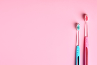 Photo of Manual toothbrushes on color background. Dental care