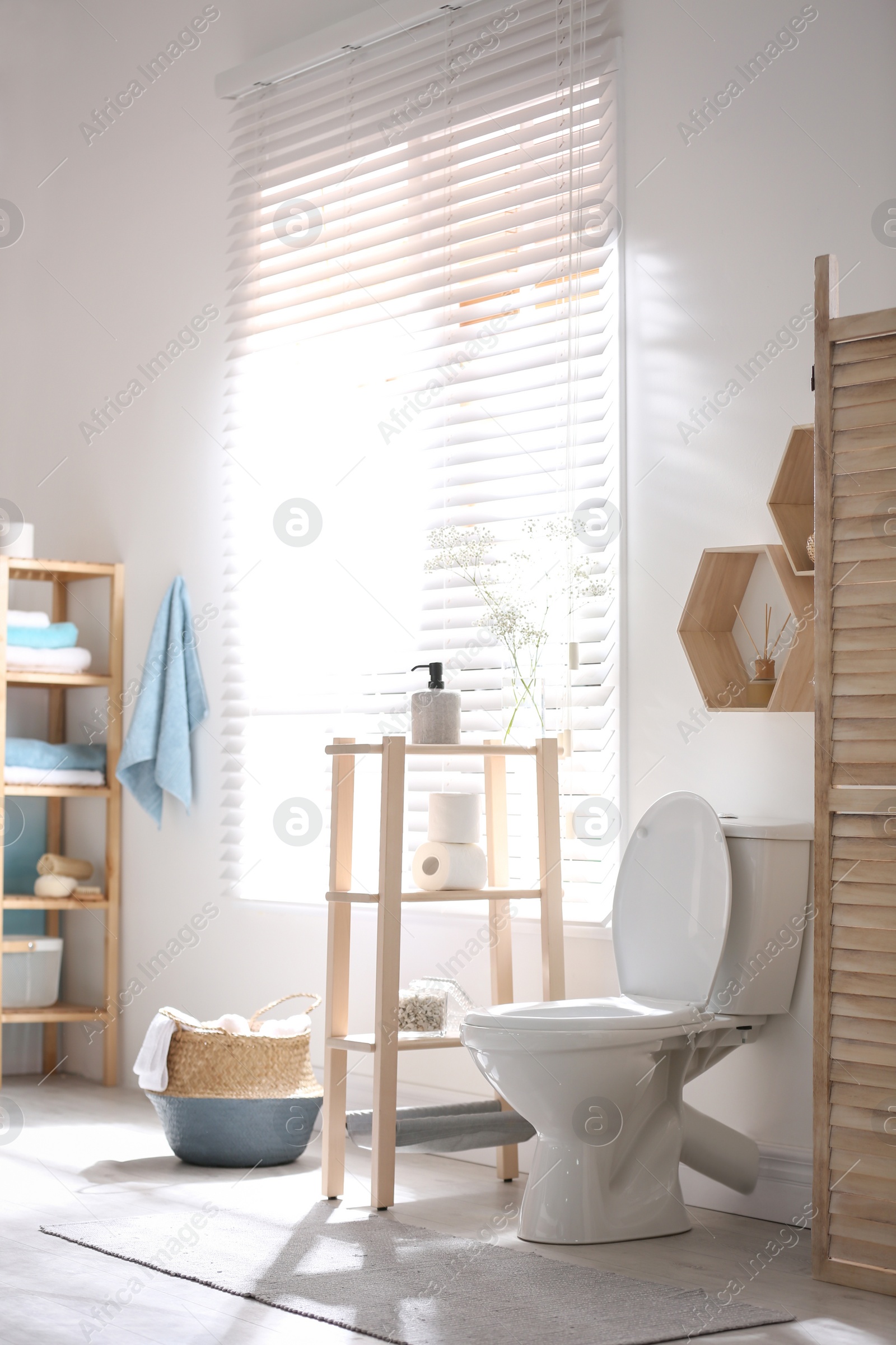 Photo of Modern toilet bowl in stylish bathroom interior