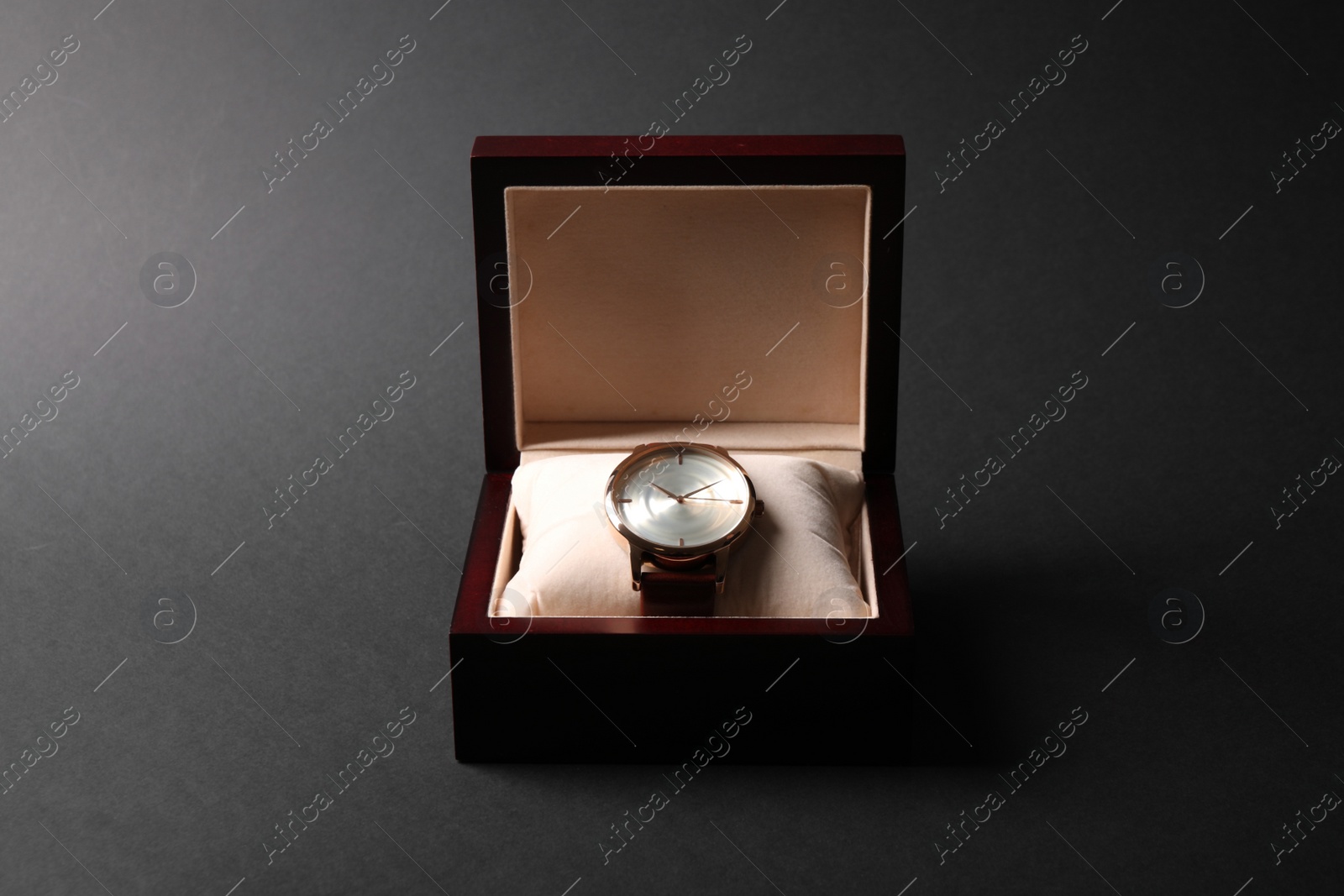 Photo of Luxury wrist watch in box on black background. Fashion accessory