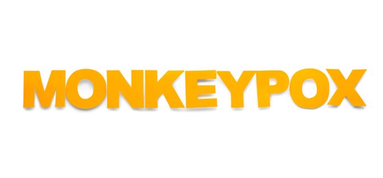 Photo of Word Monkeypox made of yellow letters on white background, top view