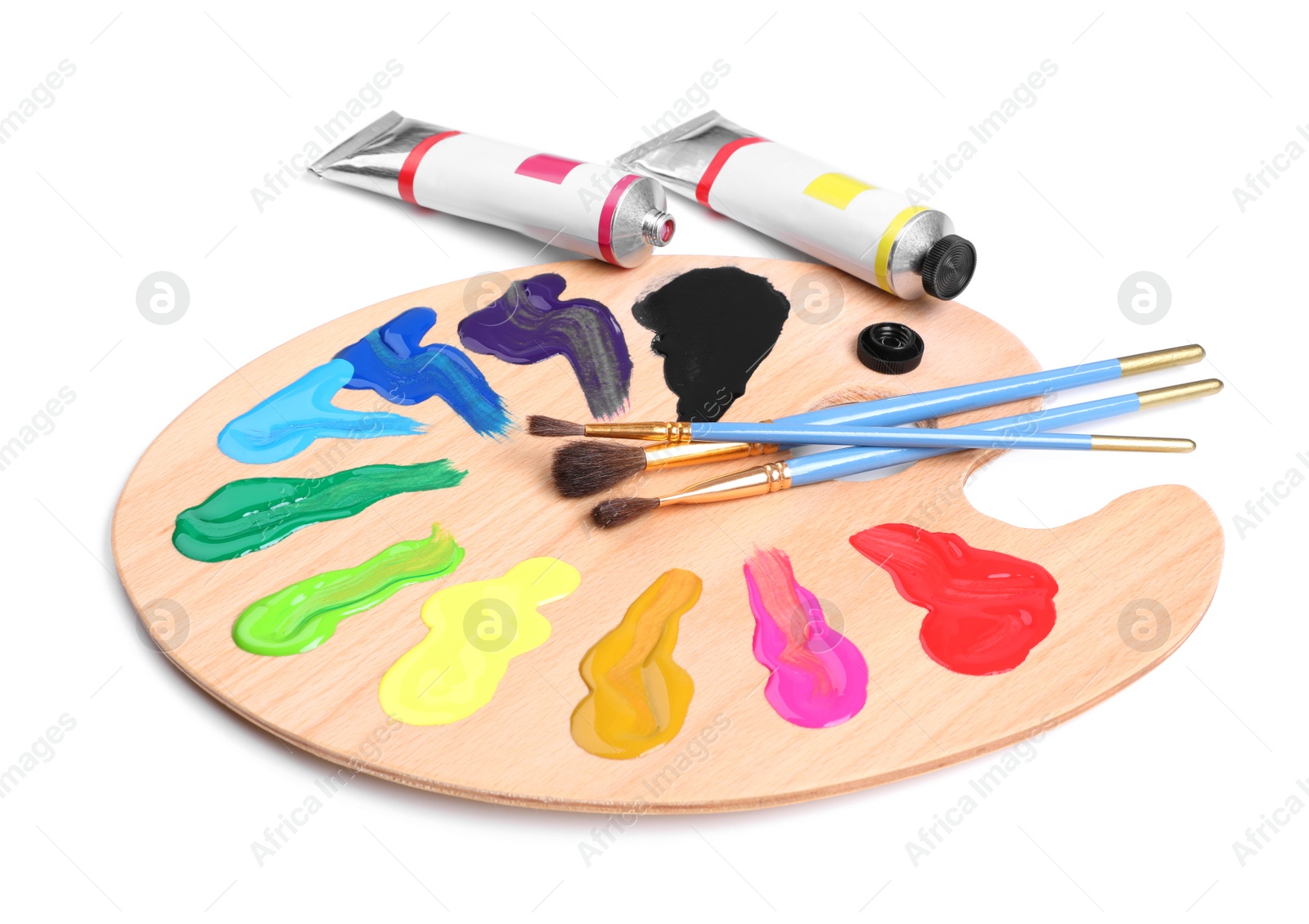 Photo of Palette with acrylic paints and brushes on white background. Artist equipment