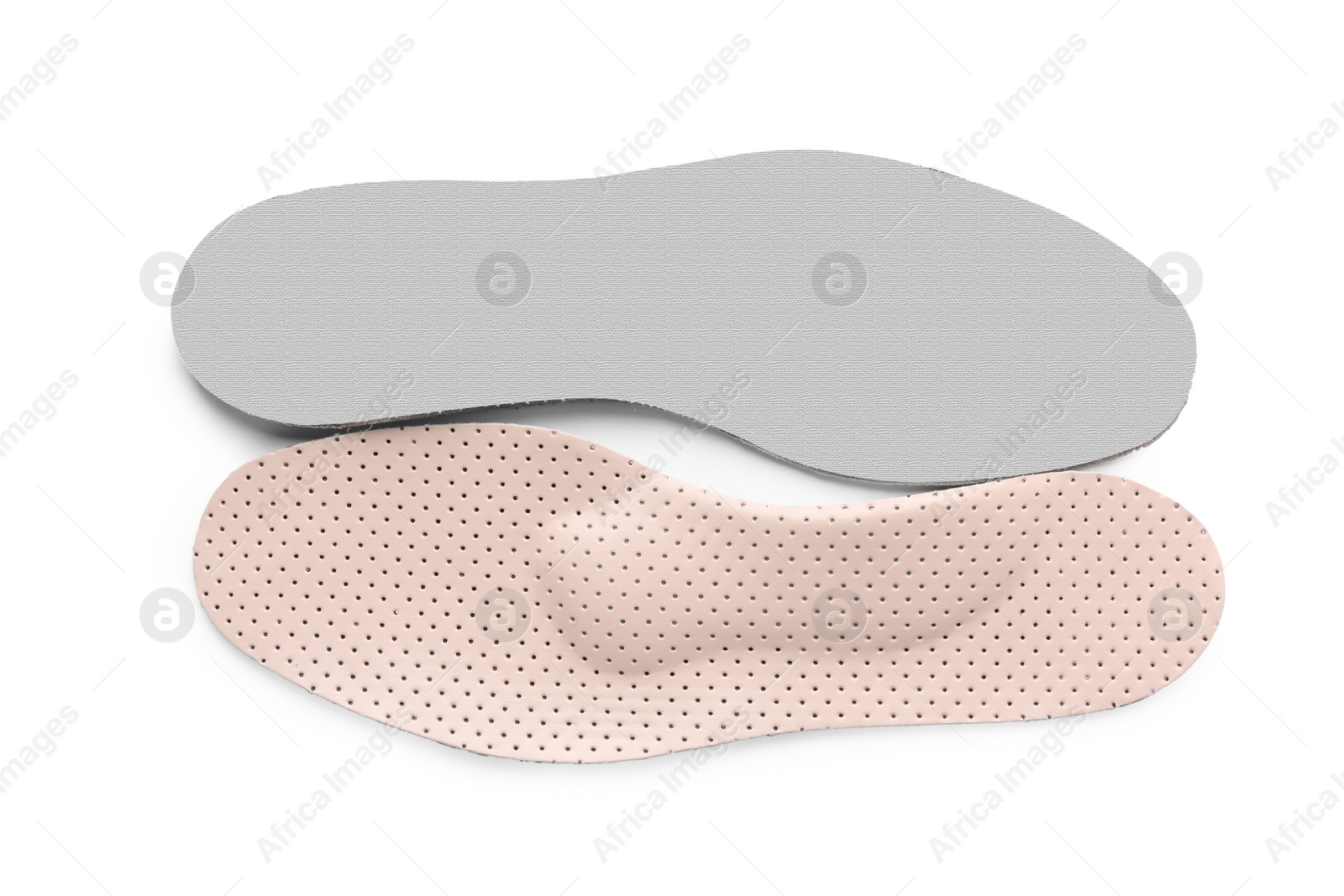 Photo of Beige orthopedic insoles isolated on white, top view