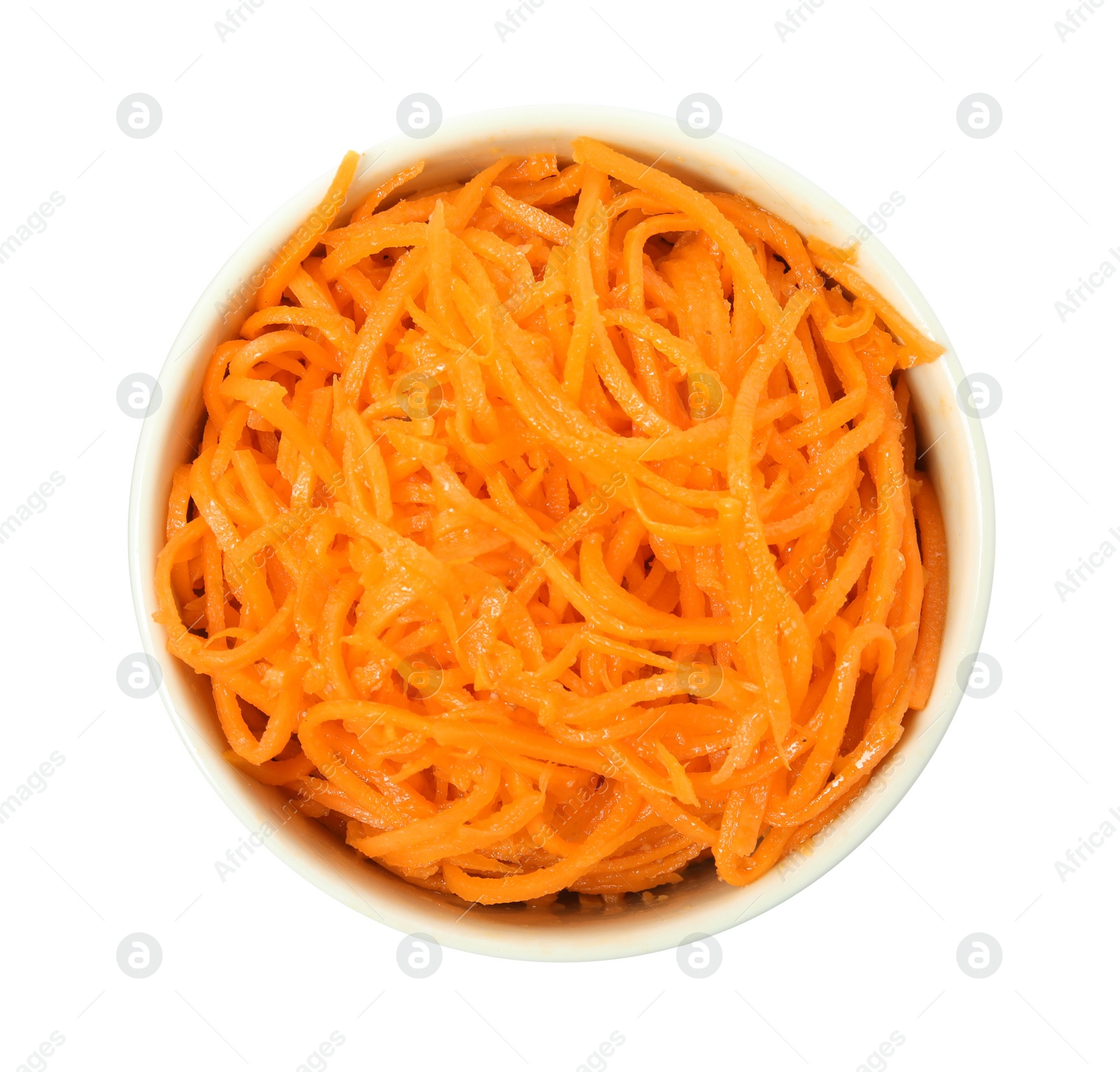 Photo of Delicious Korean carrot salad in bowl isolated on white, top view