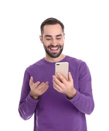 Photo of Man using mobile phone for video chat isolated on white