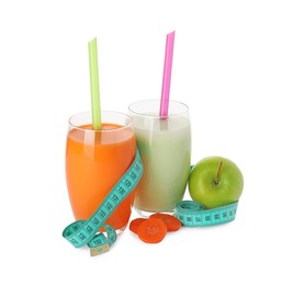 Photo of Tasty shakes, slices of carrot, apple and measuring tape isolated on white. Weight loss