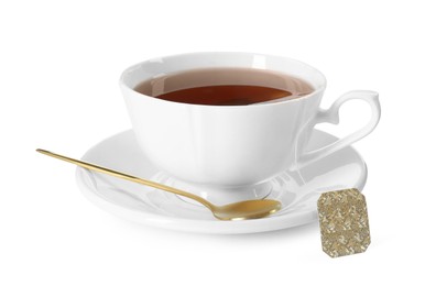 Brewing aromatic tea. Cup with teabag and golden spoon isolated on white
