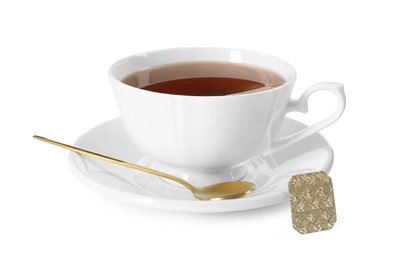 Photo of Brewing aromatic tea. Cup with teabag and golden spoon isolated on white