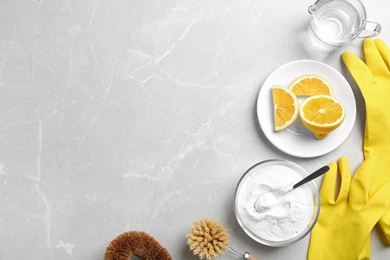 Photo of Flat lay composition with baking soda on light grey table. Space for text