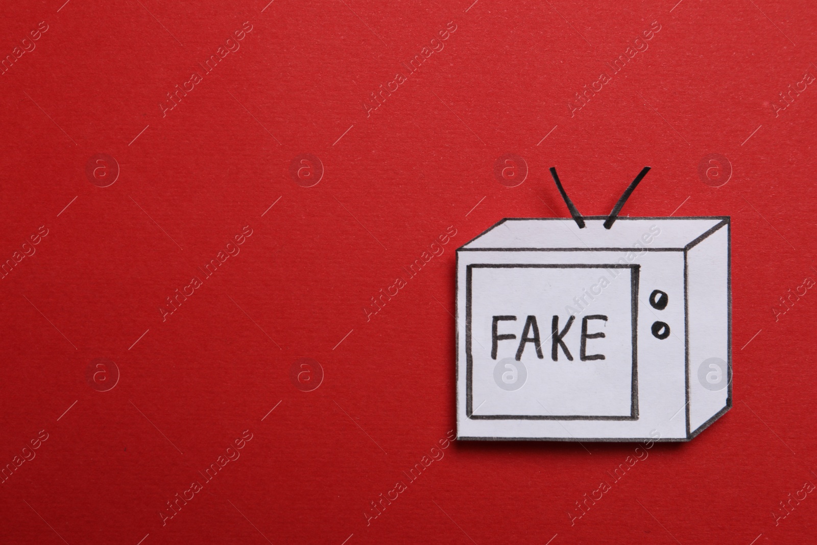 Photo of Top view of paper TV with word Fake on red background, space for text. Information warfare concept