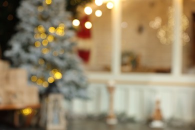 Photo of Blurred view of stylish room interior with Christmas tree and festive decor