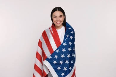 Photo of 4th of July - Independence Day of USA. Happy woman with American flag on white background