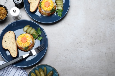 Photo of Delicious fish aspic served on grey table, flat lay. Space for text