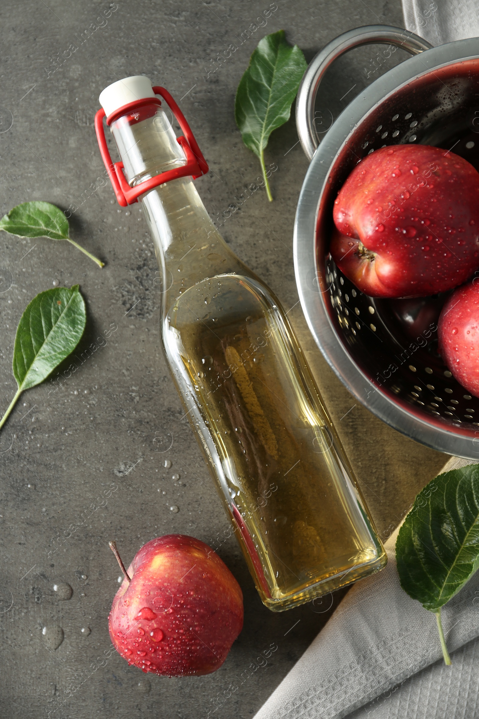 Photo of Flat lay composition with delicious apple cider on gray table