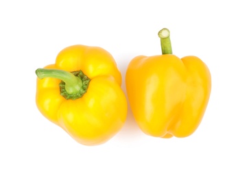 Photo of Ripe yellow bell peppers isolated on white, top view