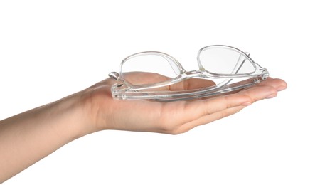 Photo of Woman holding glasses with transparent frame on white background, closeup
