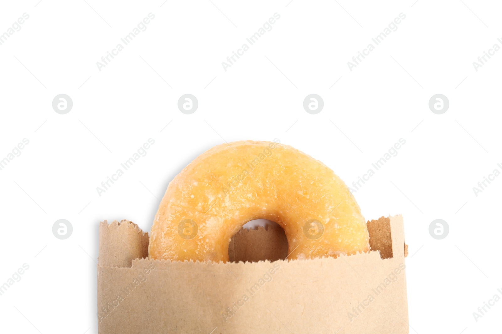 Photo of Delicious donut in paper bag isolated on white, top view