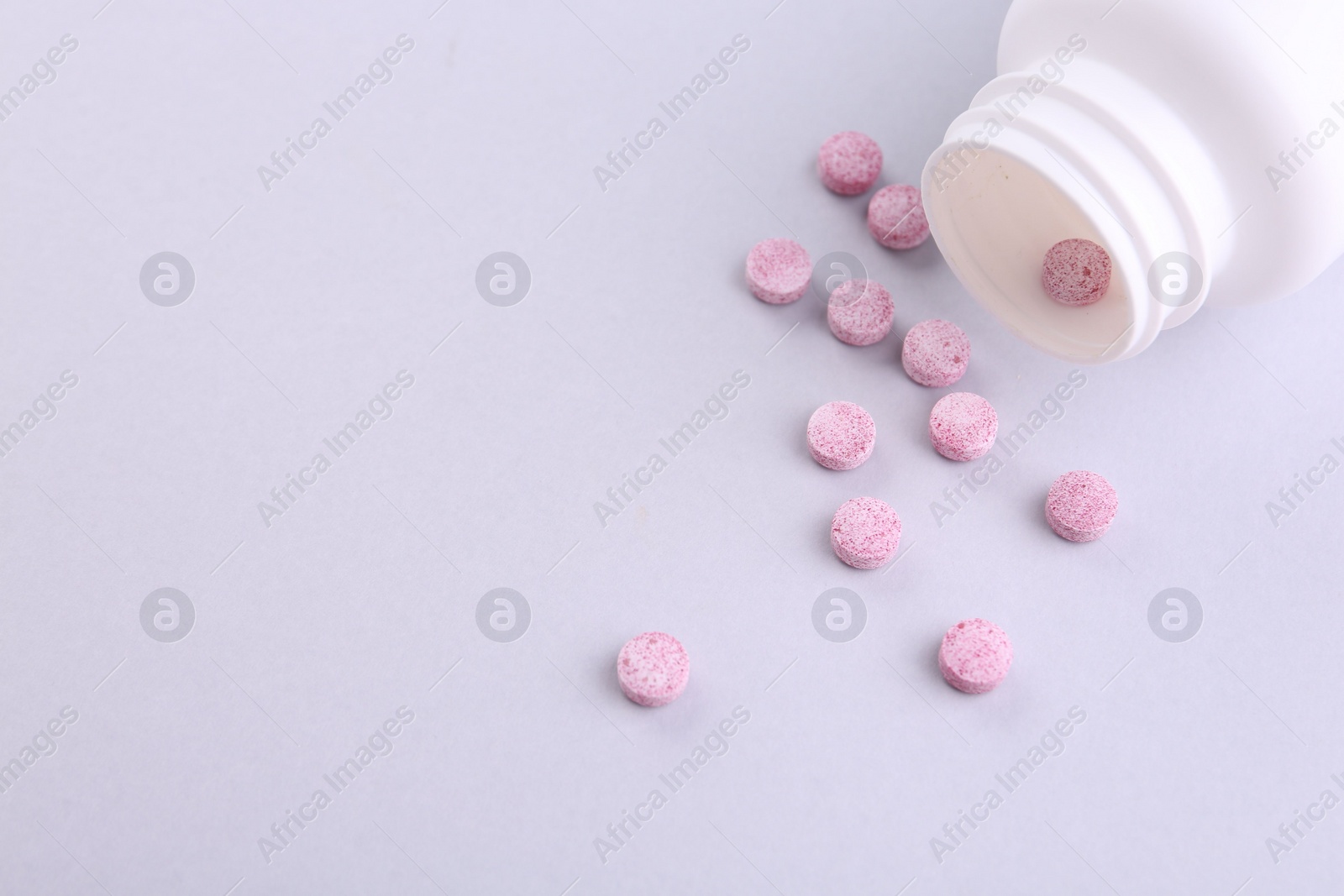 Photo of Jar with vitamin pills on white background, flat lay. Space for text