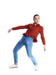 Young woman attracted to magnet on white background