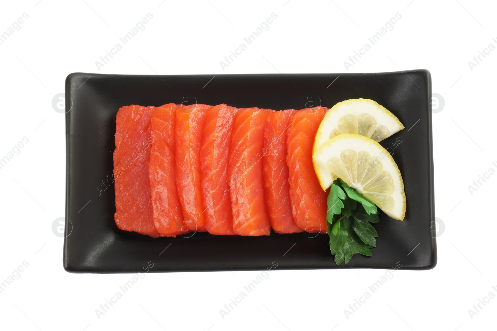 Photo of Delicious salmon sashimi served with lemon and parsley isolated on white, top view