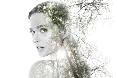 Double exposure of beautiful woman and trees on white background, color toned