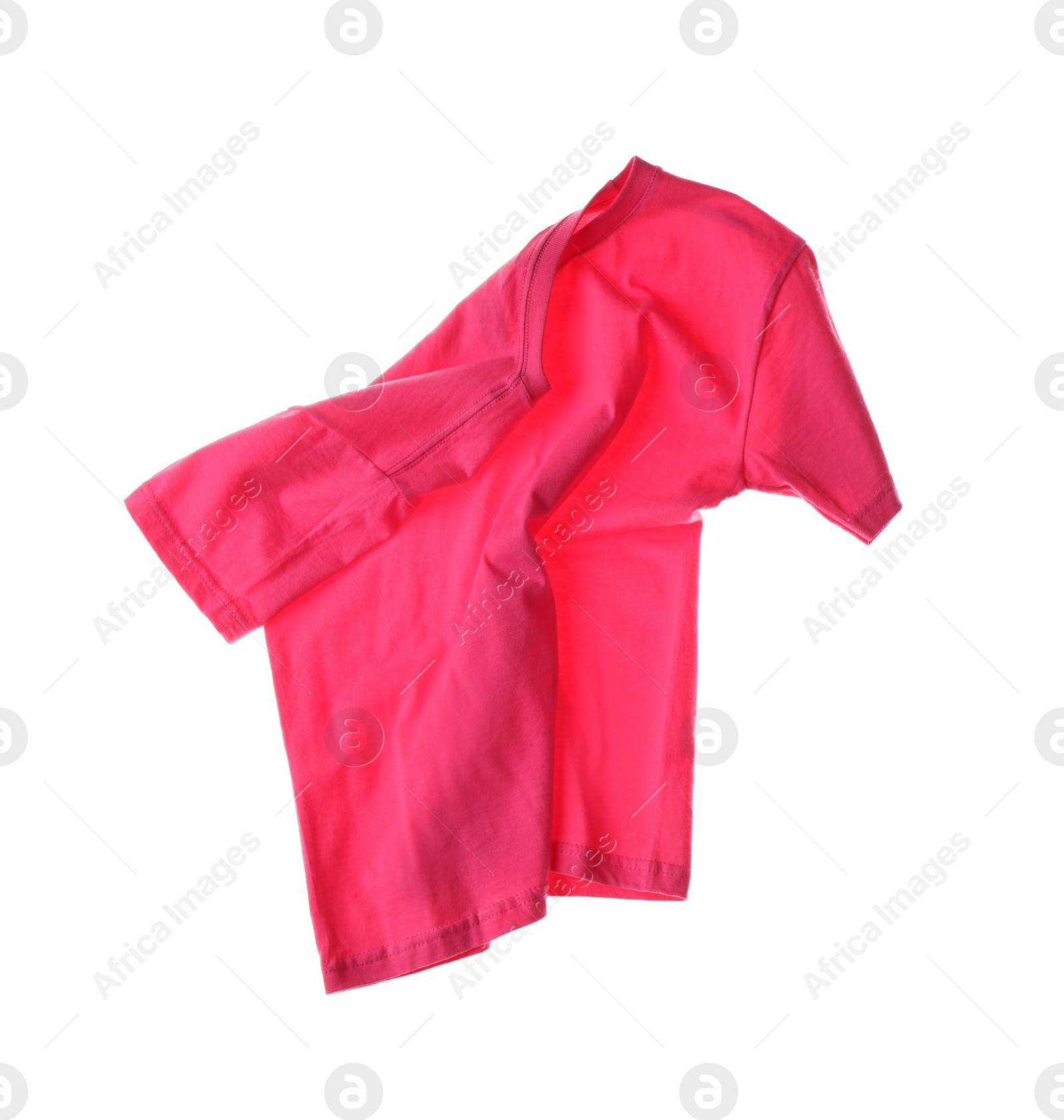 Photo of Rumpled pink t-shirt isolated on white. Messy clothes