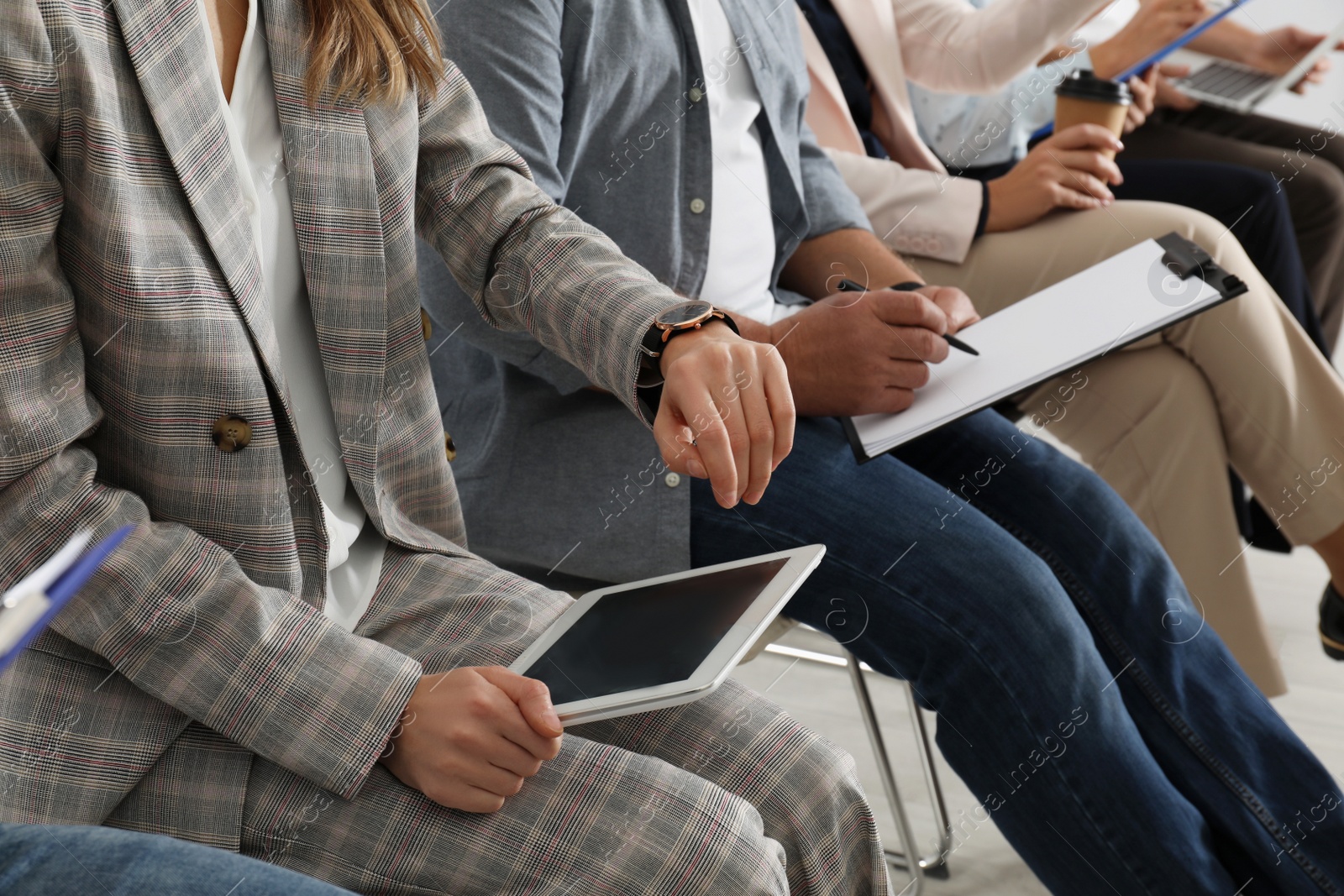 Photo of Woman with tablet waiting for job interview in office, closeup