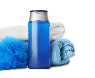 Photo of Personal hygiene product with towels and shower puff on white background