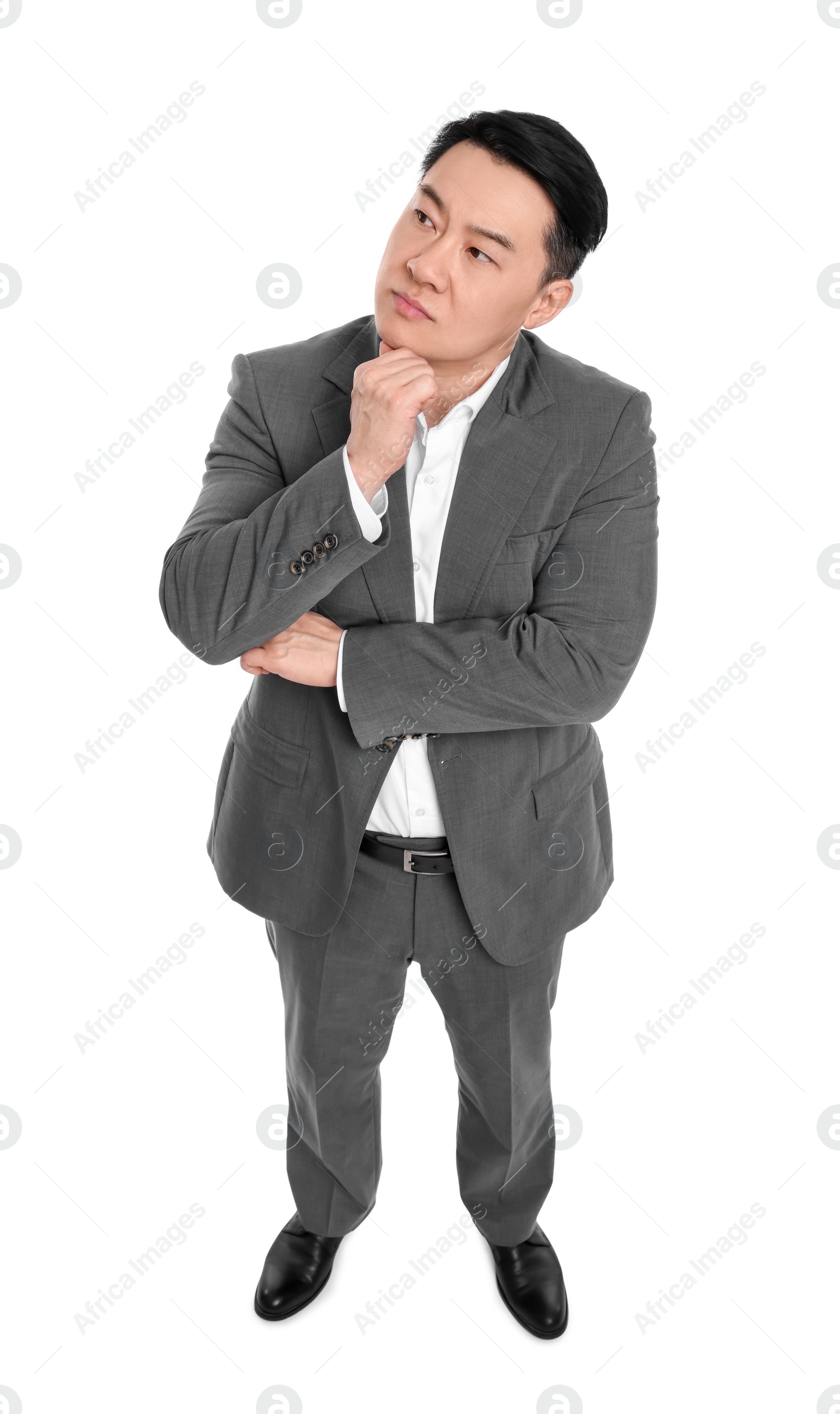 Photo of Businessman in suit posing on white background, above view