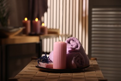 Photo of Beautiful composition with different spa products on wicker bench indoors