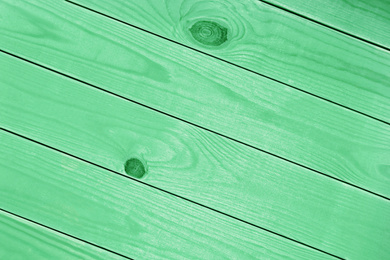 Texture of wooden surface as background. Image toned in mint color 