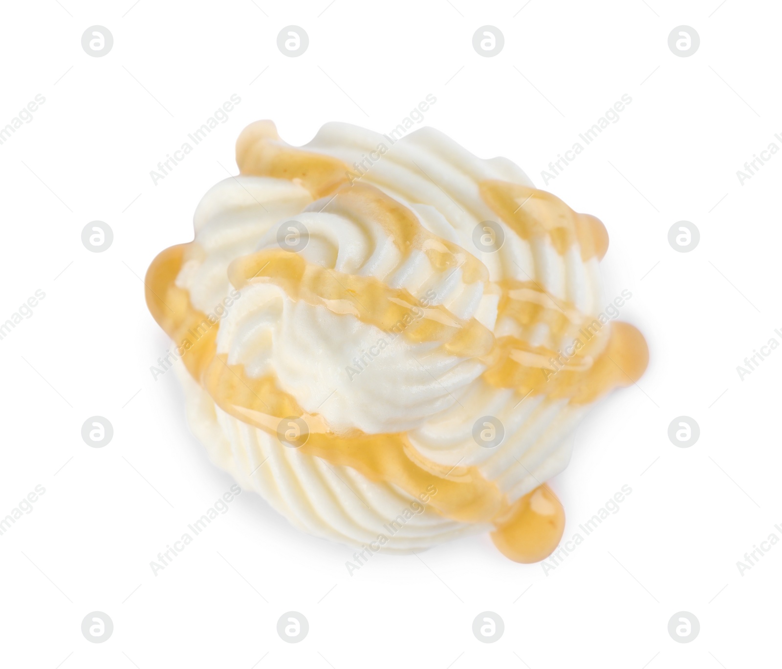 Photo of Delicious fresh whipped cream with caramel sauce isolated on white, top view