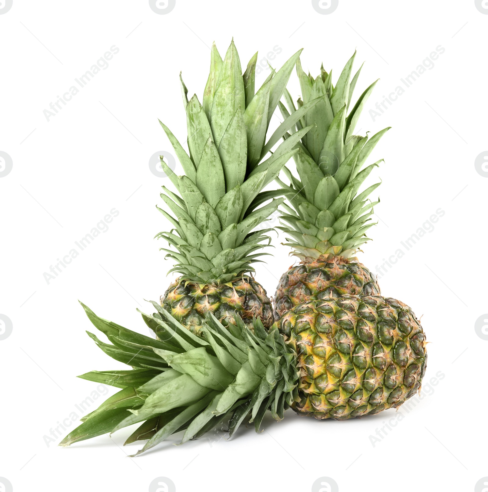 Photo of Fresh ripe juicy pineapples isolated on white