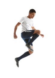 Teenage African-American boy playing football on white background