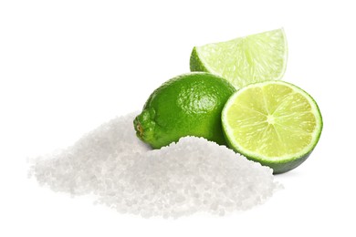 Image of Limes and salt isolated on white. Margarita cocktail ingredients