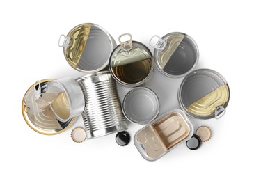 Photo of Many open tin cans isolated on white, top view