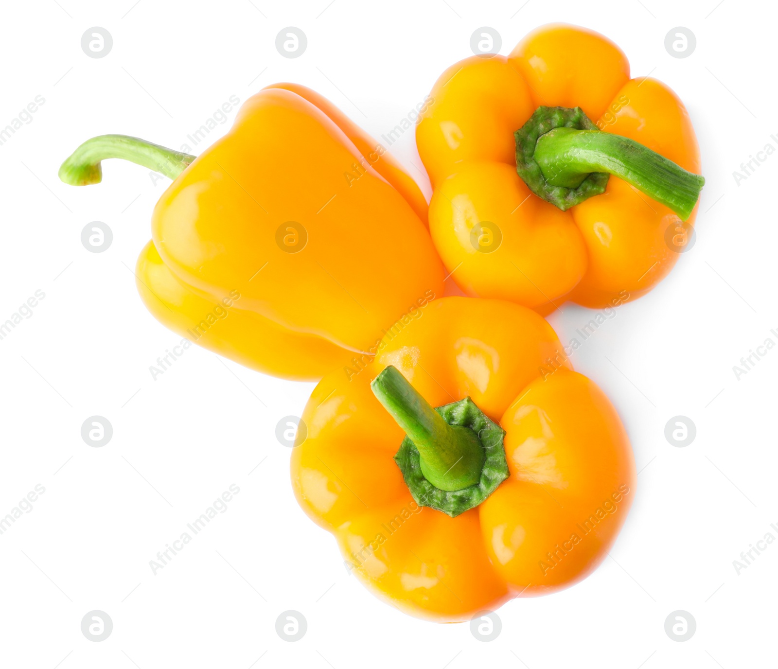 Photo of Ripe orange bell peppers isolated on white, top view