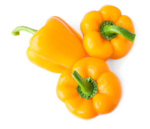 Ripe orange bell peppers isolated on white, top view