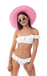 Photo of Beautiful young woman in stylish bikini with hat on white background