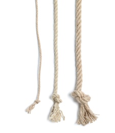 Different cotton ropes with knots on white background