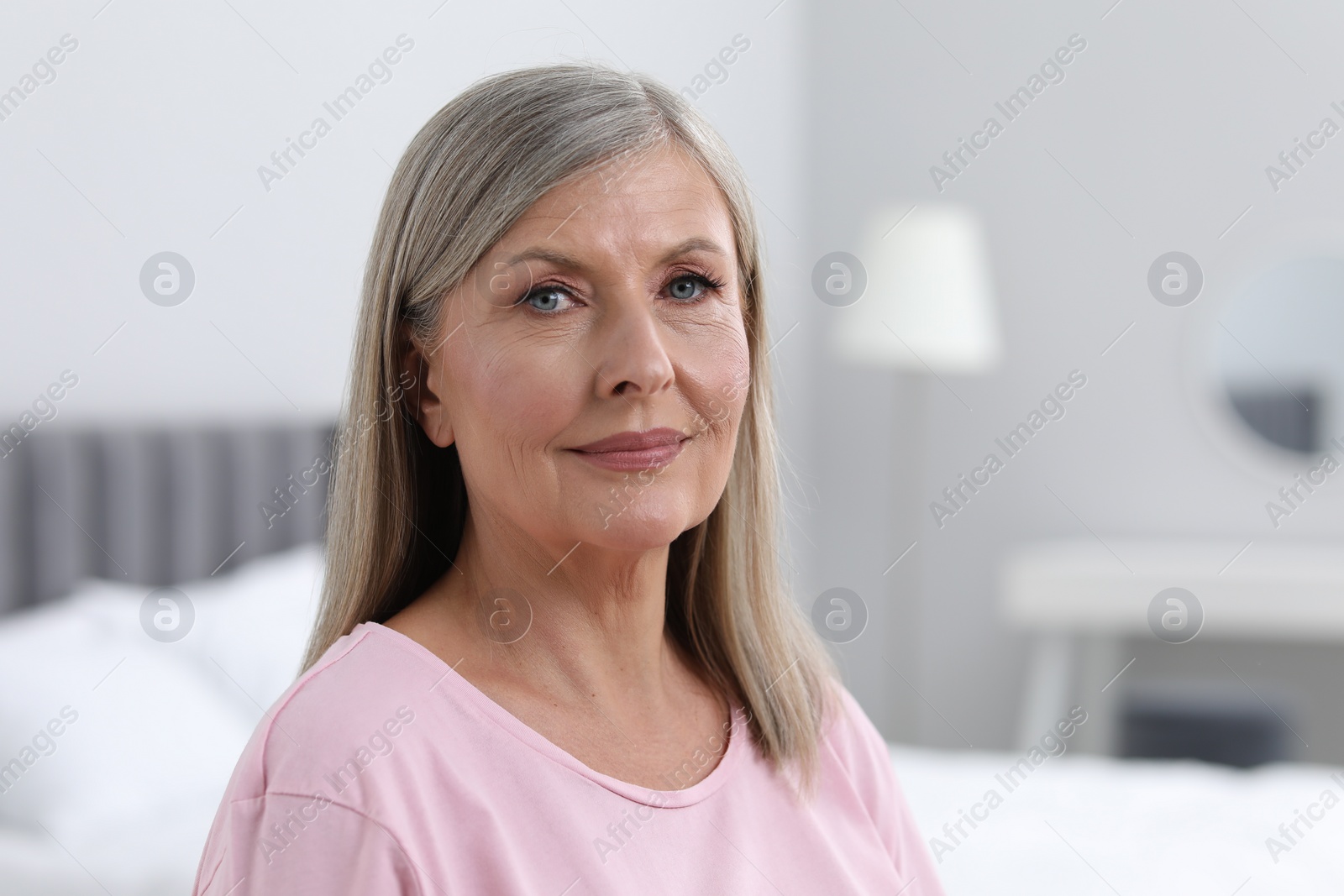Photo of Portrait of beautiful senior woman at home. Space for text