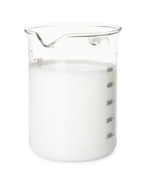 Fresh milk in measuring cup isolated on white