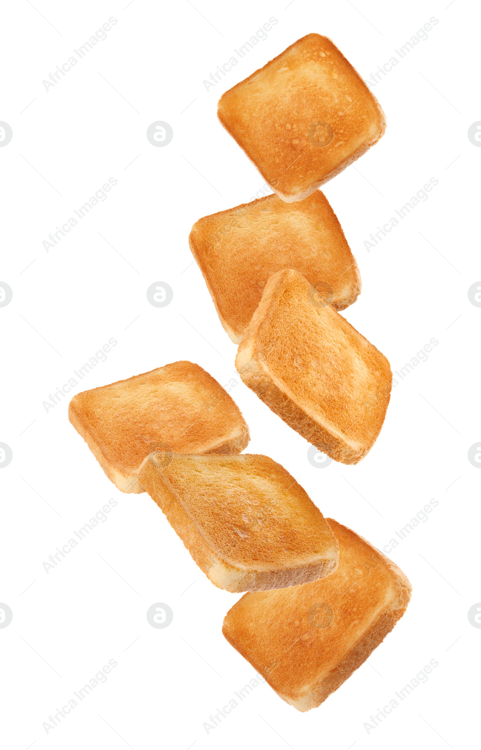 Image of Slices of tasty toasted bread falling on white background